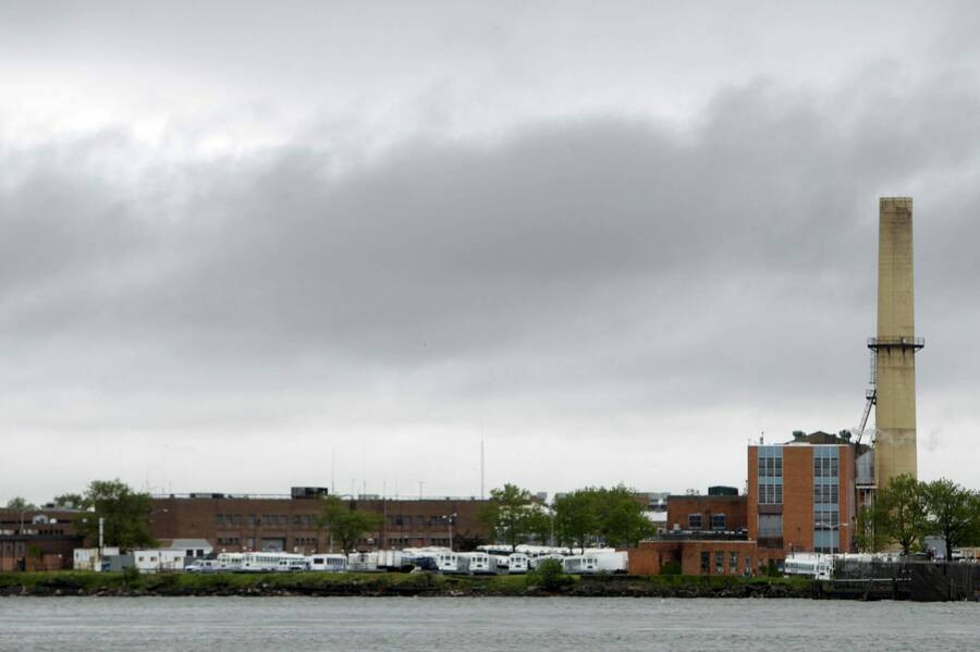 The various buildings that makeup the Rikers Island jail complex, shot from across the river.