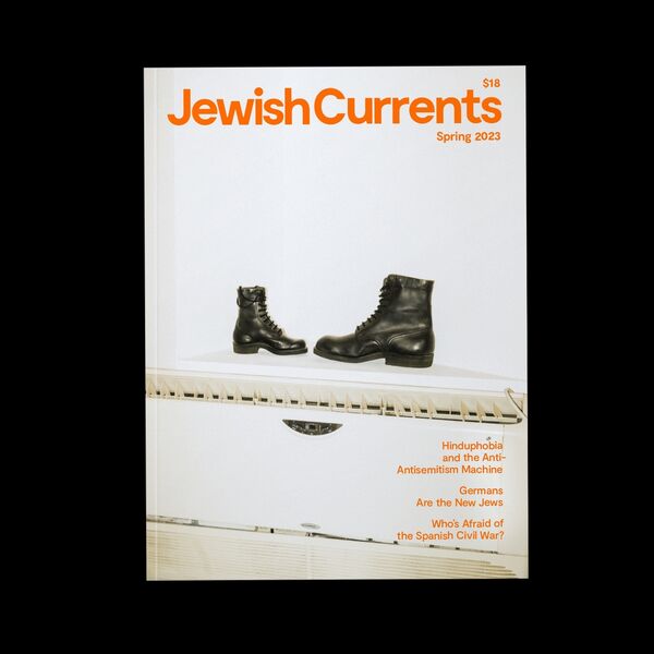 Jewish Currents Spring Issue Cover feature a photograph of a boot and orange lettering